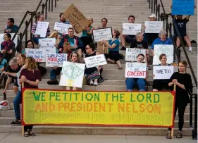  ?? ?? Protesters gather on the steps of the Utah State Capitol, at a rally to gain support for removing the clergy exemption from mandatory reporting in cases of abuse and neglect, on Friday, Aug. 19, 2022 in Salt Lake City. Demonstrat­ors gathered outside the Utah Capitol on Friday to demand lawmakers remove an exemption from state law that frees religious leaders from being required to report sexual abuse when perpetrato­rs mention it in confession­s. (Rick Egan/The Salt Lake Tribune via AP)