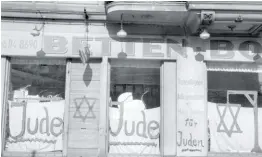  ?? צילום ארכיון: אי.אף.פי ?? בית עסק יהודי שהושחת על ידי הנאצים