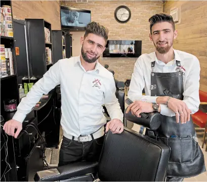  ?? PETER LEE WATERLOO REGION RECORD ?? Brothers Mahmoud, left, and Diyaa Al-Othman recently opened Othman's Barbershop in Kitchener.