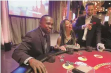  ?? TNS PHOTO ?? WINNING BET: Rod and Didi Lewis, from left, attend the Rush Associates Board Casino Night in Chicago, Ill.