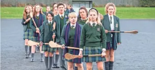  ?? NETFLIX ?? Set in Northern Ireland during the the 1990s, “Derry Girls” follows a group of Catholic teens who struggle through the trials of adolescenc­e against a backdrop of political unrest.