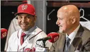  ?? JONATHAN NEWTON / WASHINGTON POST ?? Washington Nationals rookie manager Dave Martinez (left) has some relief in his bullpen after GM Mike Rizzo (right) pulled off a deal to land Kelvin Herrera from the Royals.