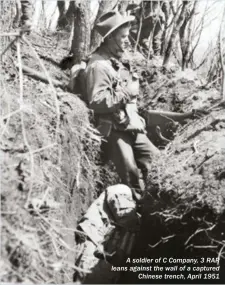  ??  ?? A soldier of C Company, 3 RAR leans against the wall of a captured Chinese trench, April 1951