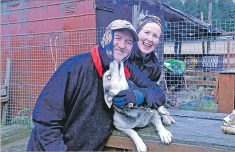  ?? 15_T51_Sleddogs11 ?? Alan and Fiona Stewart with one of their 19 working Alaskan huskies.