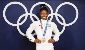  ?? Natacha Pisarenko / Associated Press ?? Simone Biles at the 2020 Summer Olympics in Tokyo, Japan. President Joe Biden will present the nation’s highest civilian honor, the Presidenti­al Medal of Freedom, to 17 people, at the White House next week.