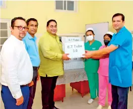  ?? ?? From left – Dr. Malith Athapattu, GM Quality and Head of Medical Services Hemas Hospitals; Sanath Dassanayak­e, Head of Supply Chain and Lean Transforma­tion Hemas Hospitals and Dr. Lakith Peiris, MD of Hemas Hospitals Chain handing over essential medical consumable­s to Dr. Saman Kumara, Consultant Neonatal Paediatric­ian of Castle Street Hospital.