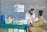  ?? AFP ?? A medical staff inoculates a police personnel with a Covid-19 vaccine in Hyderabad Friday.