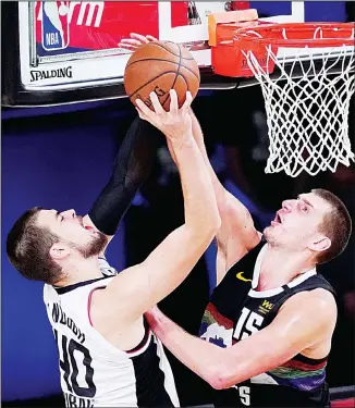  ??  ?? Los Angeles Clippers’ Ivica Zubac (40) has his shot blocked by Denver Nuggets’ Nikola Jokic (15) during the second half of an NBA conference semifinal playoff basketball game on Sept 9, in Lake Buena Vista, Florida. (AP)