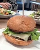  ??  ?? The newly re-opened Caritas Village cafe is serving veggie burgers from Fuel and traditiona­l burgers with grass-fed beef from Marmilu Farms. JENNIFER CHANDLER / THE COMMERCIAL APPEAL