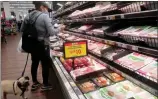  ?? MARIO TAMA GETTY IMAGES/TNS ?? A person shops for beef Monday in L.A. Food prices have risen a minimum of 19% in the last three years in Southern California.