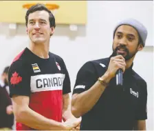  ?? GAVIN YOUNG ?? Canadian Olympic speedskate­rs Denny Morrison, left and Gilmore Junio speak to students at Ecole Holy Name in Calgary on Thursday.