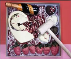  ?? SUBMITTED PHOTOS ?? A chocolate Smash Box filled with Valentine goodies is available made to order from The Rustic Grill at StoneWater in Highland Heights.