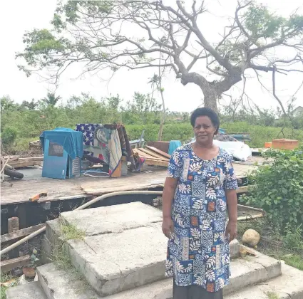  ?? Photo: Kelera Sovasiga ?? Mereseini Vulavou in front of what’s left of her home in Ekubu Village on Vatulele on May 20, 2020.