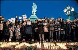  ?? MLADEN ANTONOV/GETTY-AFP ?? Opposition supporters gather Tuesday in Moscow to honor victims of a Siberian shopping mall fire that killed 64 people, including 41 children. In Kemerovo, where the blaze occurred Sunday, protesters accused regional officials of neglecting safety rules.