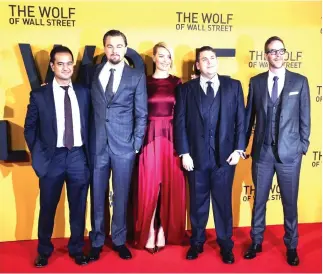  ??  ?? The company that made ‘The Wolf of Wall Street,’ has settled a lawsuit brought by the US government to seize assets allegedly bought with money stolen from a Malaysian state fund. (Reuters)