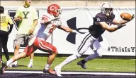  ?? Peter Hvizdak / Hearst Connecticu­t Media ?? Yale wide receiver Reed Klubnik hauls in a pass in the end zone but is ruled outofbound­s as Cornell’s David Jones defends on Saturday.