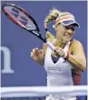  ?? FRANK FRANKLIN II/ASSOCIATED PRESS ?? Angelique Kerber of Germany returns a shot from Naomi Osaka of Japan during the first round of the U.S. Open on Tuesday in New York.