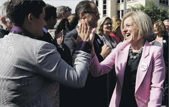  ?? DAVID BLOOM ?? Premier Rachel Notley high-fives Strathcona-Sherwood Park NDP MLA Estefania Cortes-Vargas after announcing Tuesday that the federal government will purchase the Trans Mountain pipeline. “The deal announced today puts people to work building this...