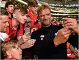  ??  ?? SOME SELFIE RESPECT: Liverpool manager Jurgen Klopp takes a photo with Liverpool fans at Aviva Stadium yesterday