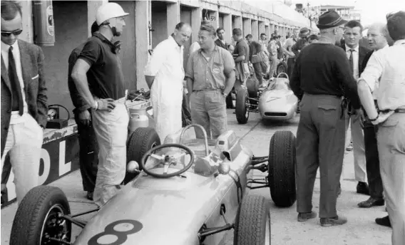  ??  ?? Above: Porsche Type 804 at the Nürburgrin­g in 1962. Jo Bonnier (left, in helmet), Wilhelm Hild and Hans Hönick (both behind the vehicle), right, facing camera, Hans Mezger