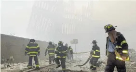  ?? Photo / AP ?? New York City firefighte­rs work in the rubble of the twin towers.