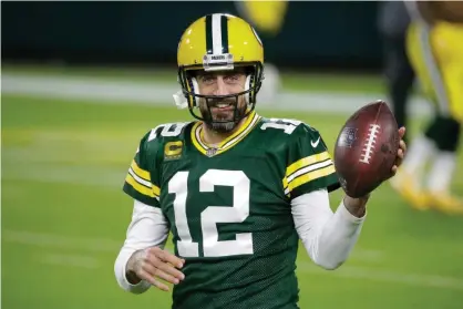  ??  ?? Aaron Rodgers warms up before a game against the Chicago Bears in November 2020 Photograph: Mike Roemer/AP