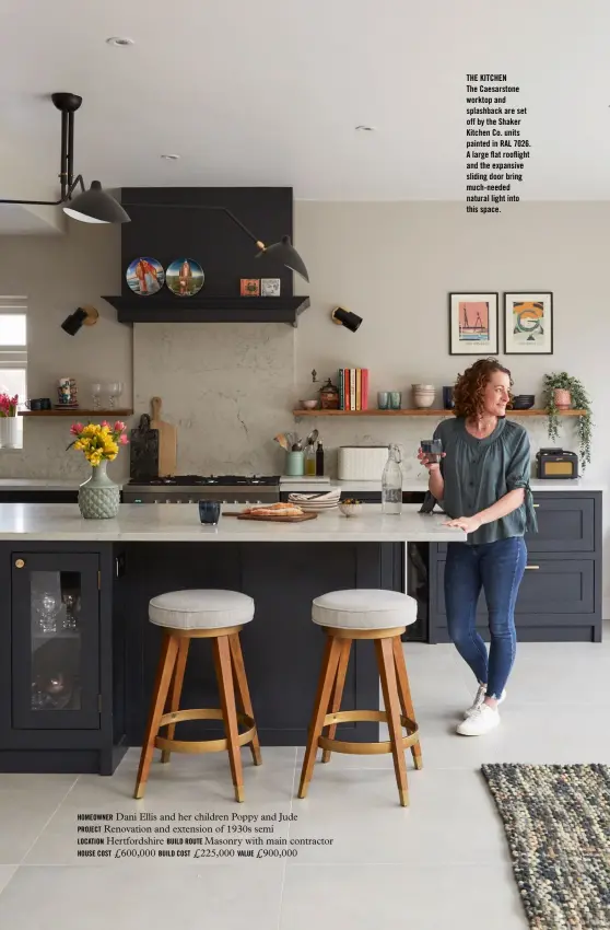  ??  ?? HOMEOWNER Dani Ellis and her children Poppy and Jude
PROJECT Renovation and extension of 1930s semi
LOCATION Hertfordsh­ire BUILD ROUTE Masonry with main contractor HOUSE COST £600,000 BUILD COST £225,000 VALUE £900,000
THE KITCHEN
The Caesarston­e worktop and splashback are set off by the Shaker Kitchen Co. units painted in RAL 7026. A large flat rooflight and the expansive sliding door bring much-needed natural light into this space.