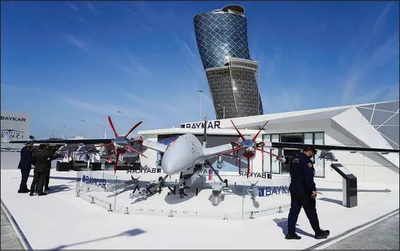  ?? PHOTOS BY JON GAMBRELL / AP ?? A drone made by Turkish manufactur­er Baykar is seen Feb. 20 at the Internatio­nal Defense Exhibition and Conference in Abu Dhabi, United Arab Emirates. The war in Ukraine, now in its second year, has jacked the global arms trade, fueling a new appetite for materiel not just in Moscow and Kyiv but also around the world as nations gird themselves for possible confrontat­ions.