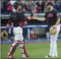  ?? PHIL LONG — ASSOCIATED PRESS ?? Yan Gomes and closer Cody Allen celebratea­fter the Indians’ 3-1 win over the White Sox Oct. 2.