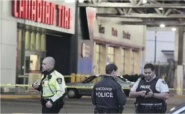  ?? NICK PROCAYLO/POSTMEDIA FILES ?? Officers were called to a Grandview Highway Canadian Tire in 2016 after a robbery suspect stabbed one person and took another hostage.