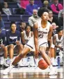  ?? Stephen Dunn / Associated Press ?? UConn’s Christyn Williams controls the ball during the second half against Cincinnati Wednesday in Storrs.