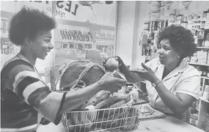  ?? MIKE SLAUGHTER TORONTO STAR ARCHIVES ?? Grocery markets are a longstandi­ng staple of Little Jamaica — especially as the community’s gateway to authentic Caribbean cuisine, filled with goods not available in mainstream stores.