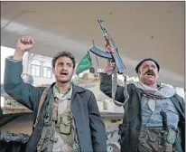  ?? AP PHOTO ?? Houthi Shiite fighters chant slogans as they guard a street leading to the residence of former Yemeni President Ali Abdullah Saleh, in Sanaa, Yemen, Monday. Saleh was killed by Shiite rebels, Monday as their forces battled for control of the capital,...