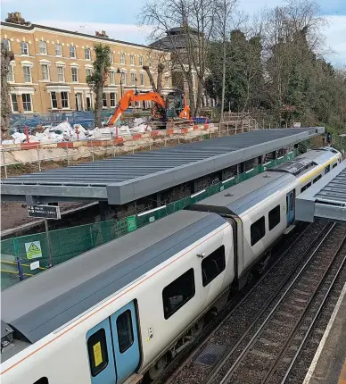  ?? NETWORK RAIL. ?? The new photovolta­ic film is only 3mm thick, but it has an expected 40-year life expectancy. The station’s environmen­tal enhancemen­ts led to it receiving a Highly Commended rating at RAIL’s 2021 National Rail Awards.