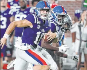  ?? Rogelio V. Solis The Associated Press ?? Mississipp­i quarterbac­k John Rhys Plumlee, shown against Vanderbilt last Saturday in Oxford, Miss., rushed for more than 100 yards in each of his first two starts for the Rebels.