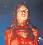  ?? EI SCAN ?? Sissy Spacek as Carrie White gets drenched with pig blood at the prom in this scene from the King adaptation Carrie.
