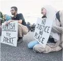  ??  ?? Protesters pause for a moment of silence following the death of 62-year-old Ejaz Choudry, who was fatally shot by Peel police officers.