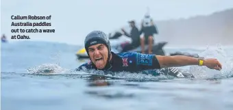  ?? ?? Callum Robson of Australia paddles out to catch a wave at Oahu.