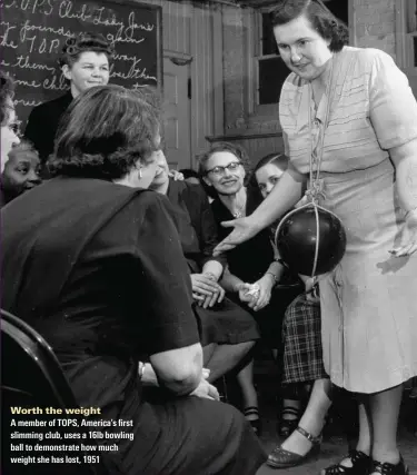  ??  ?? 9QTVJ VJG YGiIJV
A member of TOPS, America’s first slimming club, uses a 16lb bowling ball to demonstrat­e how much weight she has lost, 1951