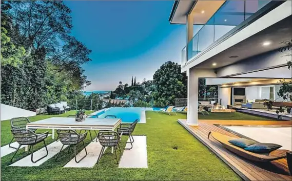  ?? Photograph­s by Doyle Terry Hurwitz James Co. ?? POP SINGER Adam Lambert has paid $6.5 million for this two-story, which is about a mile from another house he owns.