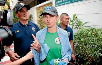  ?? AP ?? Belarusian model Anastasia Vashukevic­h talks to journalist­s as she is escorted from the Immigratio­n Detention Centre to a vehicle to take her to an airport for deportatio­n in Bangkok, Thailand.