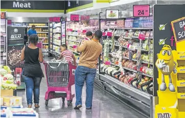  ?? Picture: GETTY IMAGES ?? MIDDLING: Consumers are generally gloomy about SA’s economy — but some aren’t too worried about their own finances