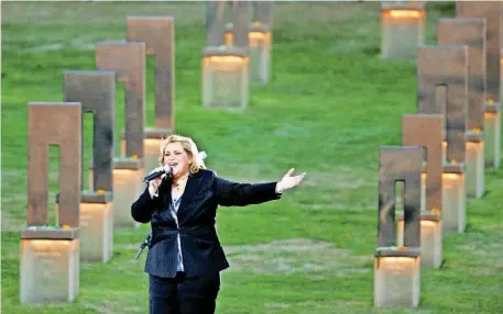  ?? [PHOTO BY DOUG HOKE, THE OKLAHOMAN ARCHIVES] ?? Gospel recording artist Sandi Patty performs at the 2005 Oklahoma City National Memorial Community Candleligh­t Ceremony in Oklahoma City.