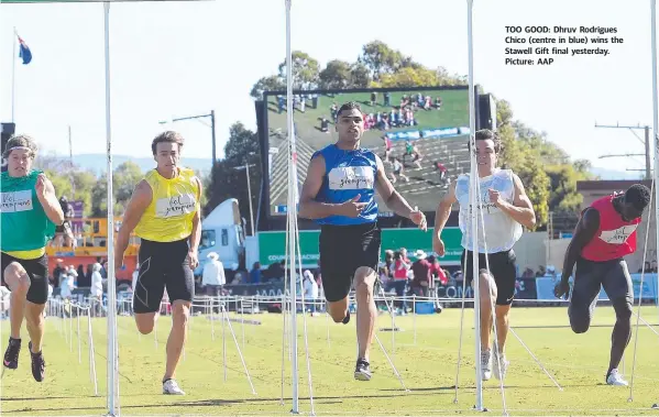  ??  ?? TOO GOOD: Dhruv Rodrigues Chico (centre in blue) wins the Stawell Gift final yesterday. Picture: AAP