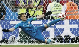  ?? PHOTO/ANTONIO CALANNI AP ?? Russia goalkeeper Igor Akinfeev saves the last penalty shot by Spain’s Iago Aspas during the round of 16 match between Spain and Russia at the 2018 soccer World Cup at the Luzhniki Stadium in Moscow, Russia, on Sunday.