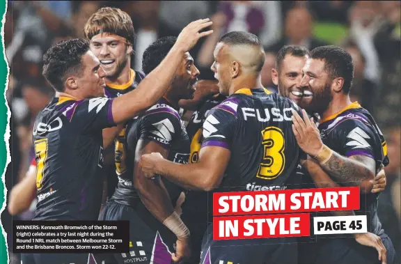  ??  ?? WINNERS: Kenneath Bromwich of the Storm (right) celebrates a try last night during the Round 1 NRL match between Melbourne Storm and the Brisbane Broncos. Storm won 22-12.