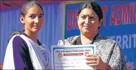  ?? ANI & NITIN KANOTRA PHOTOS ?? Union railways minister Piyush Goyal inaugurati­ng indoor sports stadium at Akhnoor in Jammu (left); and minister for women and child developmen­t Smriti Irani presenting a certificat­e to a student at Katra in Jammu on Sunday