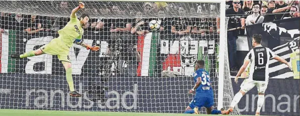  ??  ?? In it goes: Juventus’ Sami Khedira scoring the second goal during the Serie A match against Bologna on Saturday. — AP