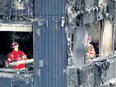  ?? GETTY IMAGES FILES ?? Members of the emergency services work on the charred remains of the Grenfell Tower block in west London. British Prime Minister Theresa May is calling for a major national investigat­ion into the deadly fire.