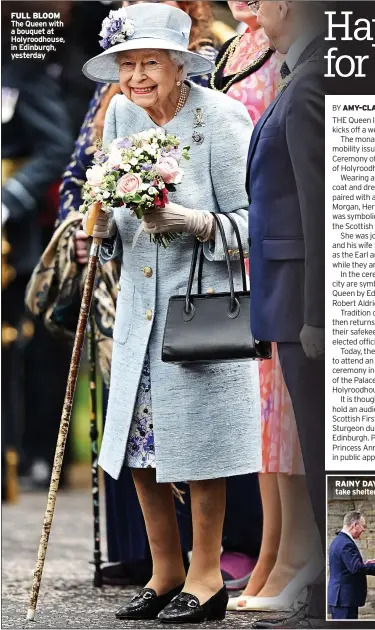  ?? ?? FULL BLOOM The Queen with a bouquet at Holyroodho­use, in Edinburgh, yesterday